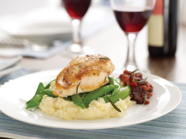 Pan-roasted chicken breasts with tomato compote and parsnip puree
