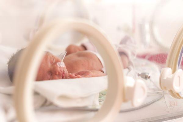 Premature babies may have better chance of survival with less treatment, trial finds
