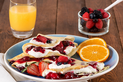 Orange Crepes with Whipped Cream and Berries