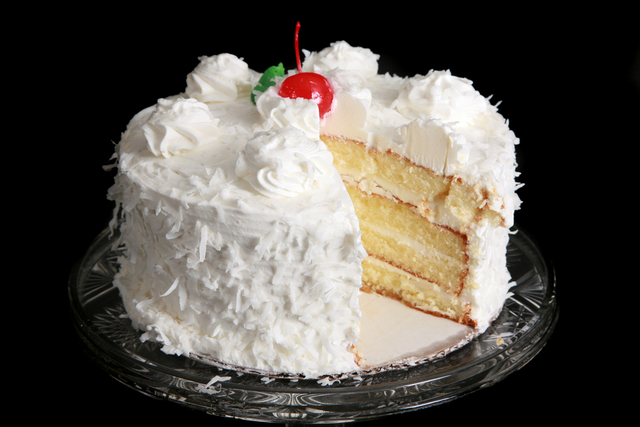 Coconut layer cake with meringue frosting