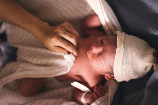 What is involved in a newborn’s physical examination and why do they do it?