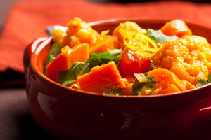 Winter vegetable curry with carrots, peas and tomatoes