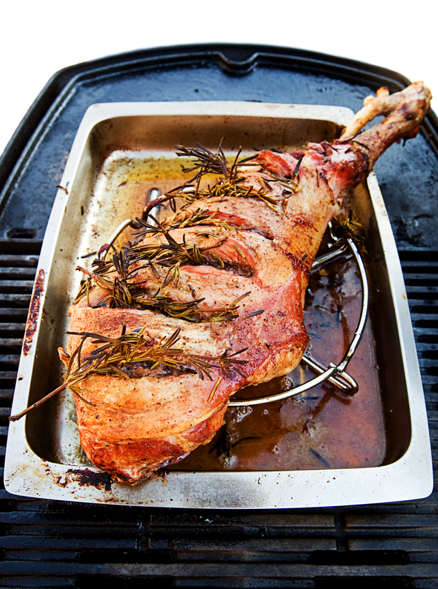 Roast lamb studded with rosemary and garlic