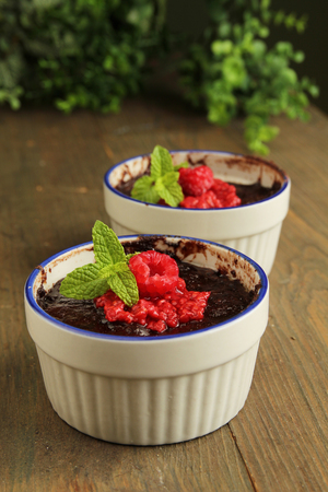 Indulgent chocolate fondants with raspberry coulis
