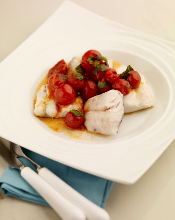 Hake with tomatoes and basil