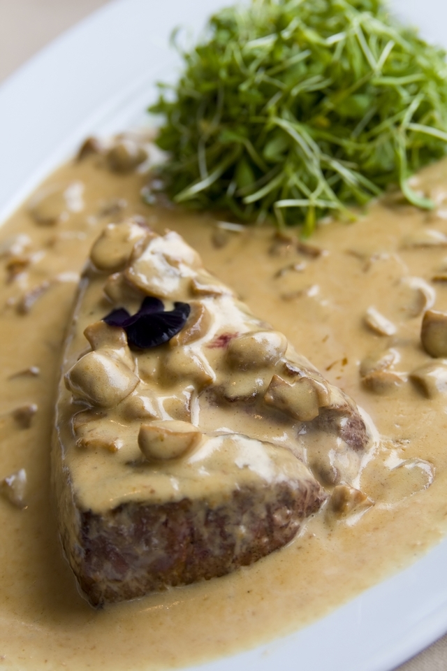 Prime steak with a creamy mushroom sauce