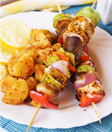Pesto chicken kebabs with roasted vegetables