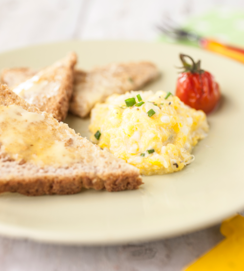 Scrambled eggs with cheese and tomatoes