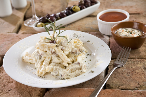 Homemade carbonara sauce with penne pasta