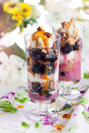 Blackberry parfait with ice-cream, caramel and pecan nuts