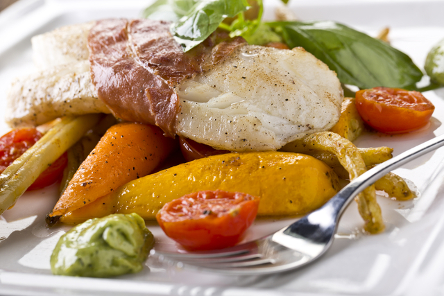 Roasted cod with parma ham and peppers