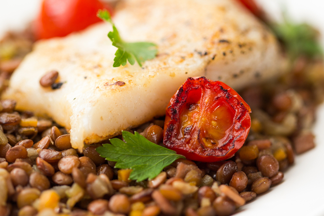 Lentils and cod with braised tomatoes and bacon 