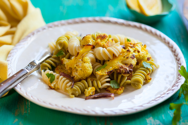 Fusilli pasta tossed vegetables and a curried dressing