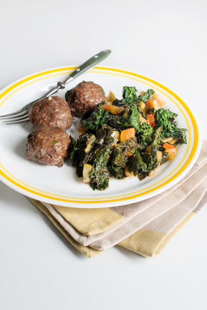 Beef meatballs with wilted kale and vegetables