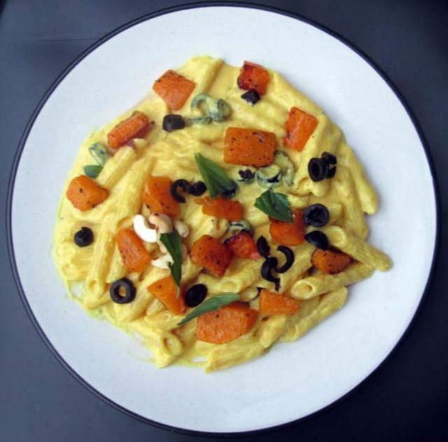 Creamy penne with roasted pumpkin and black olives