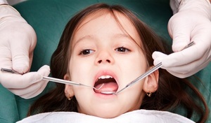 When is the ideal time for a child to see an orthodontist?