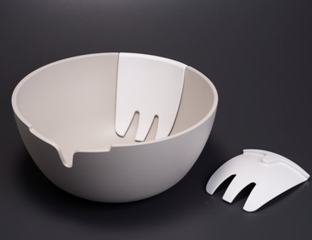 Hands on salad bowl and servers