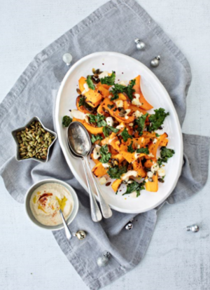 Butternut squash wedges with crispy kale and houmous