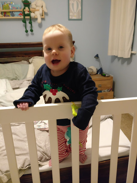 Baby in christmas pudding stripey pyjamas