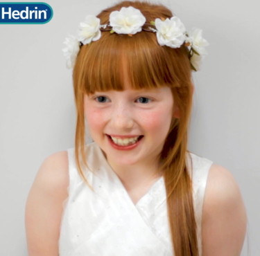 Gorgeous First Holy Communion hairstyle with flowers